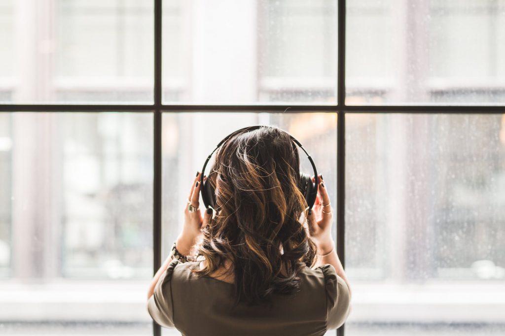 woman listening on headphones