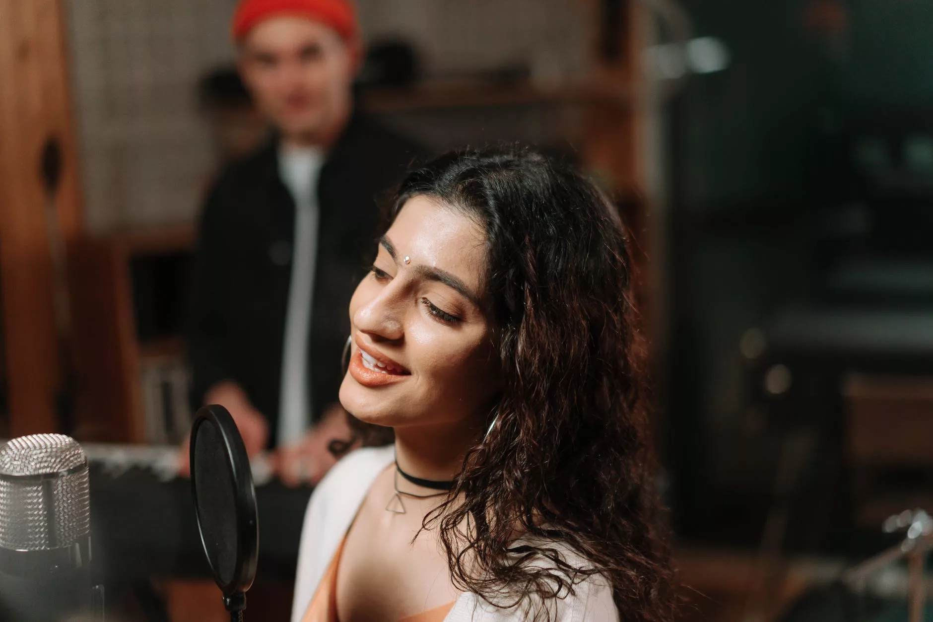 woman singing in a recording studio