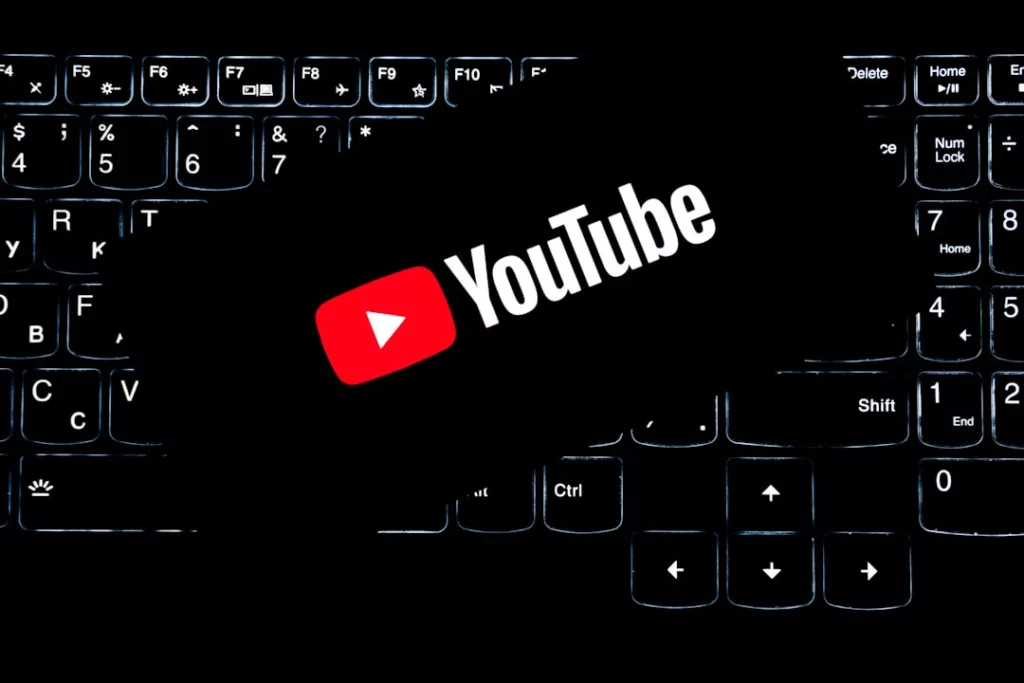 Music royalties from YouTube - Youtube logo on a backlit keyboard.