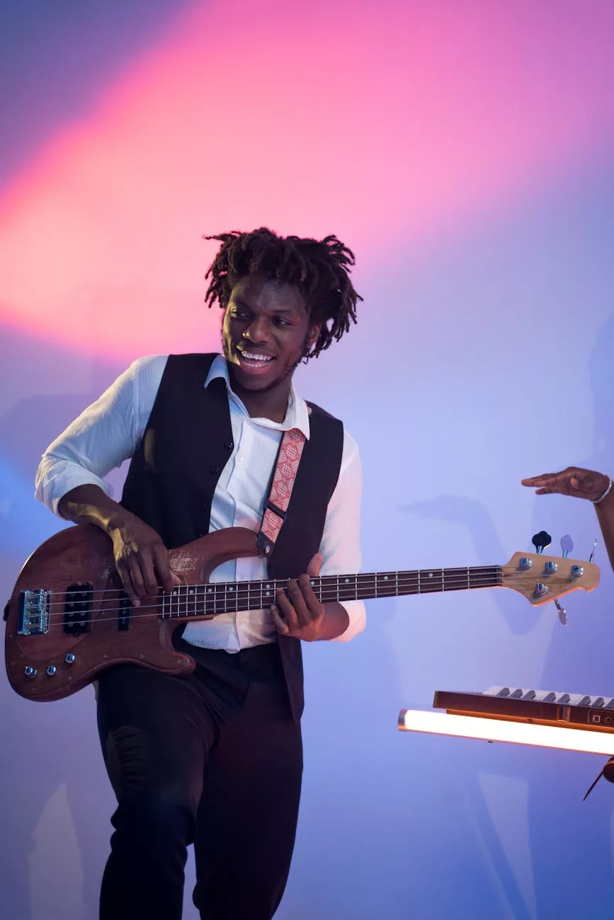 man playing the guitar while standing