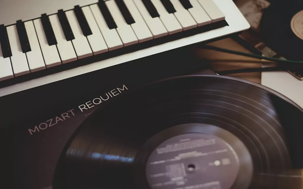Best day to release music - vinyl record near white electronic keyboard